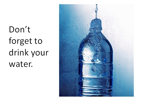 image of a bottle of water with a needle in the top